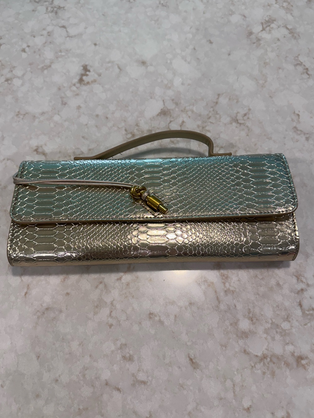 Metallic clutch. Very light gold.